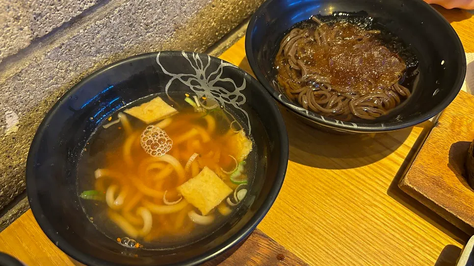 Udon and soba served alongside the sushi