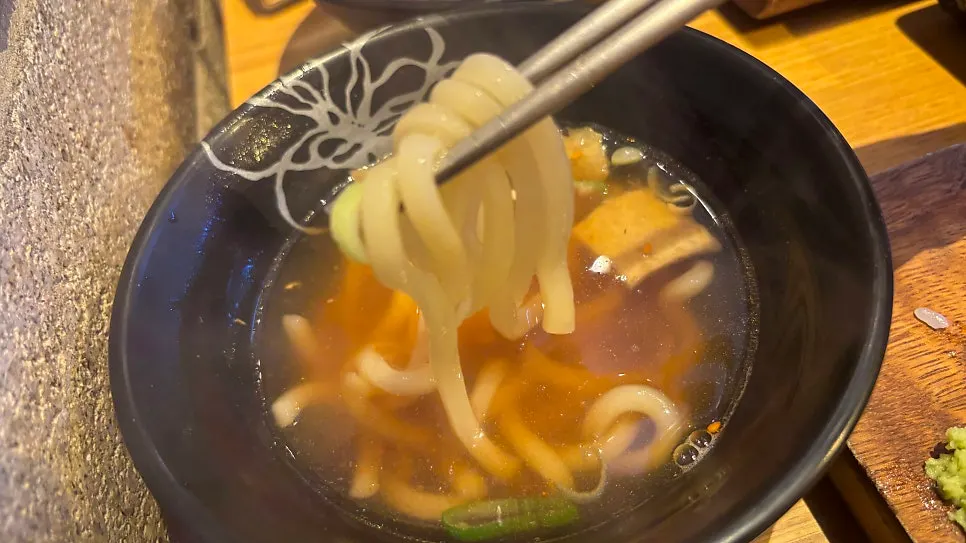 Udon topped with fried tofu skin and scallions