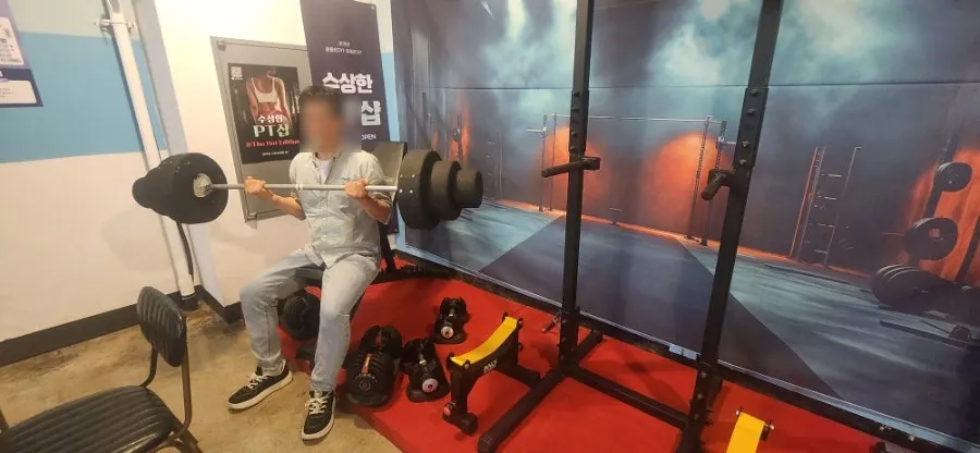 Lightweight barbell prop placed at the photo zone
