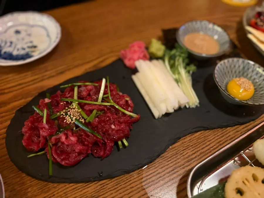 Soy-marinated hanwoo yukhoe with raw egg, pear, and radish sprouts