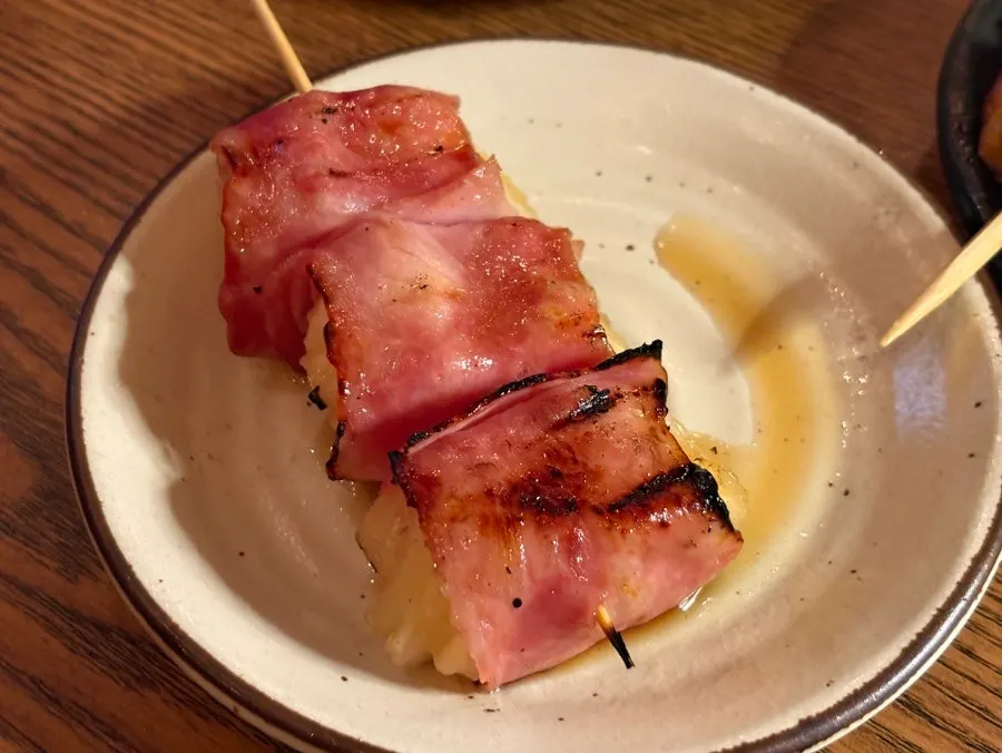 Close-up of the pineapple bacon skewer