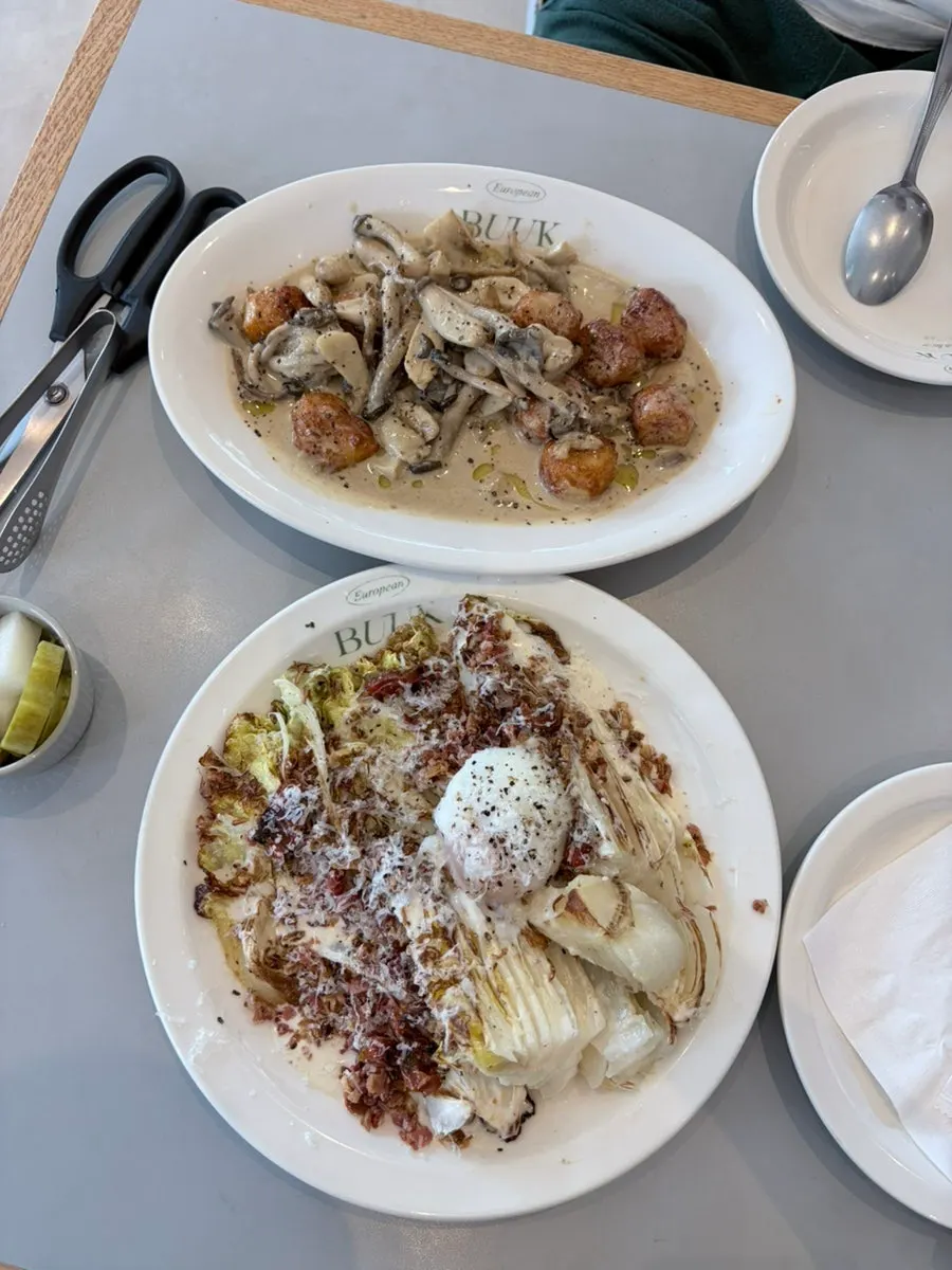 Roasted cabbage salad topped with poached egg and cheese