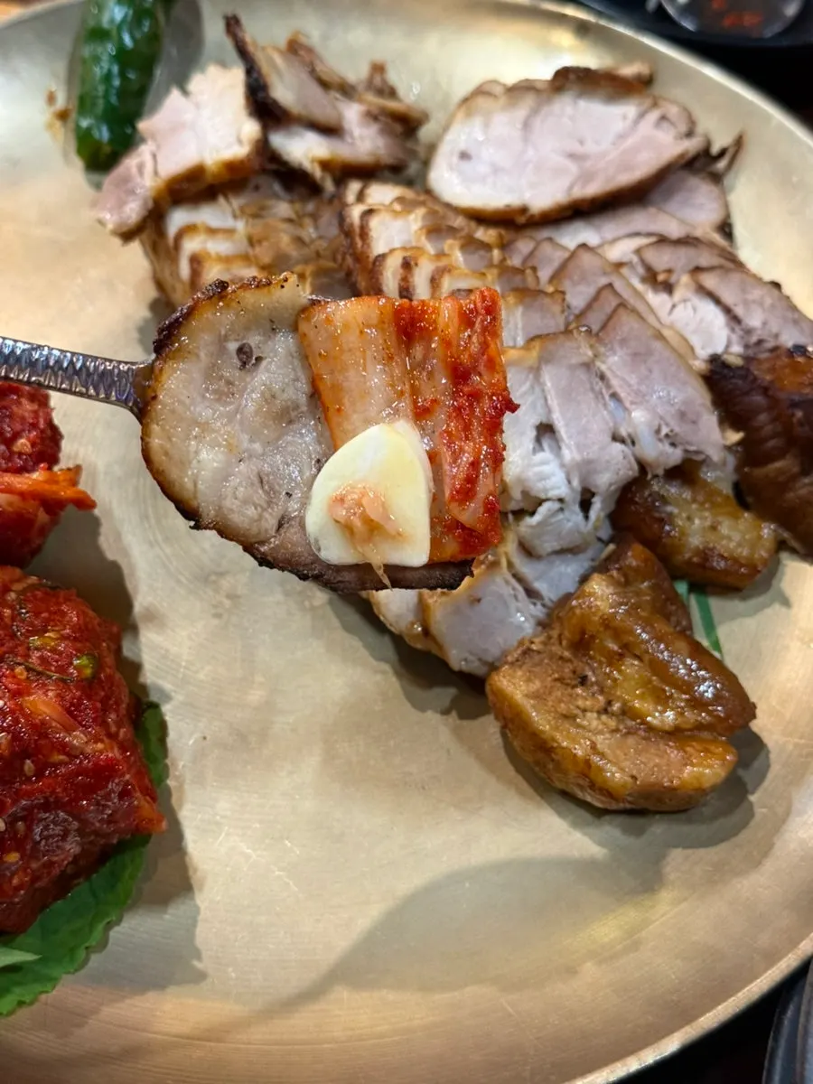 A full spread of bossam meat and bossam kimchi