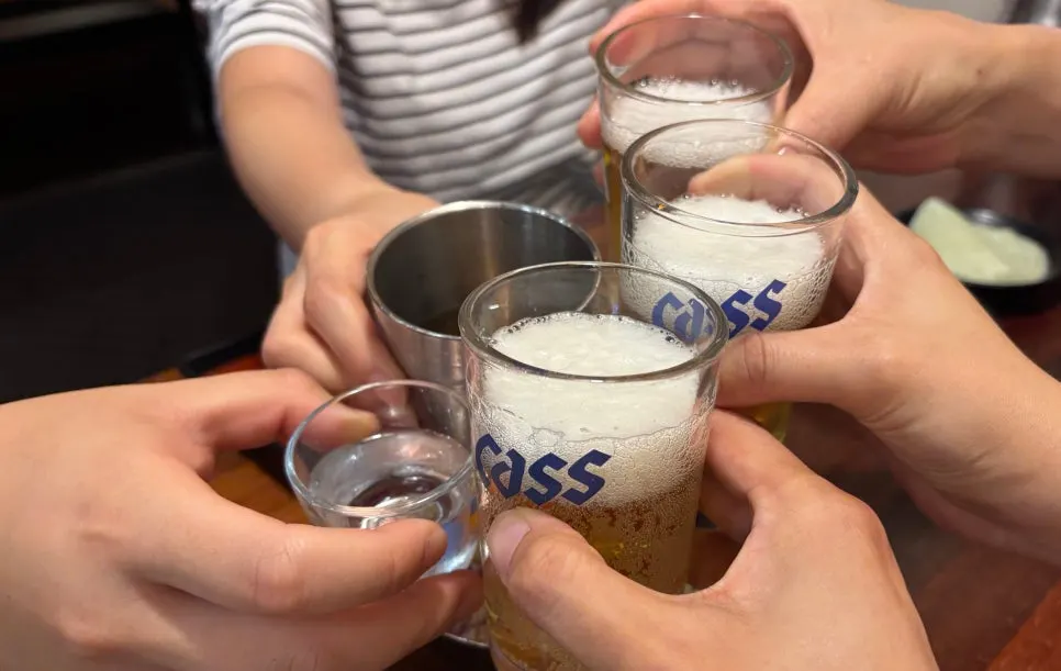 Family drinks with jokbal as a side dish