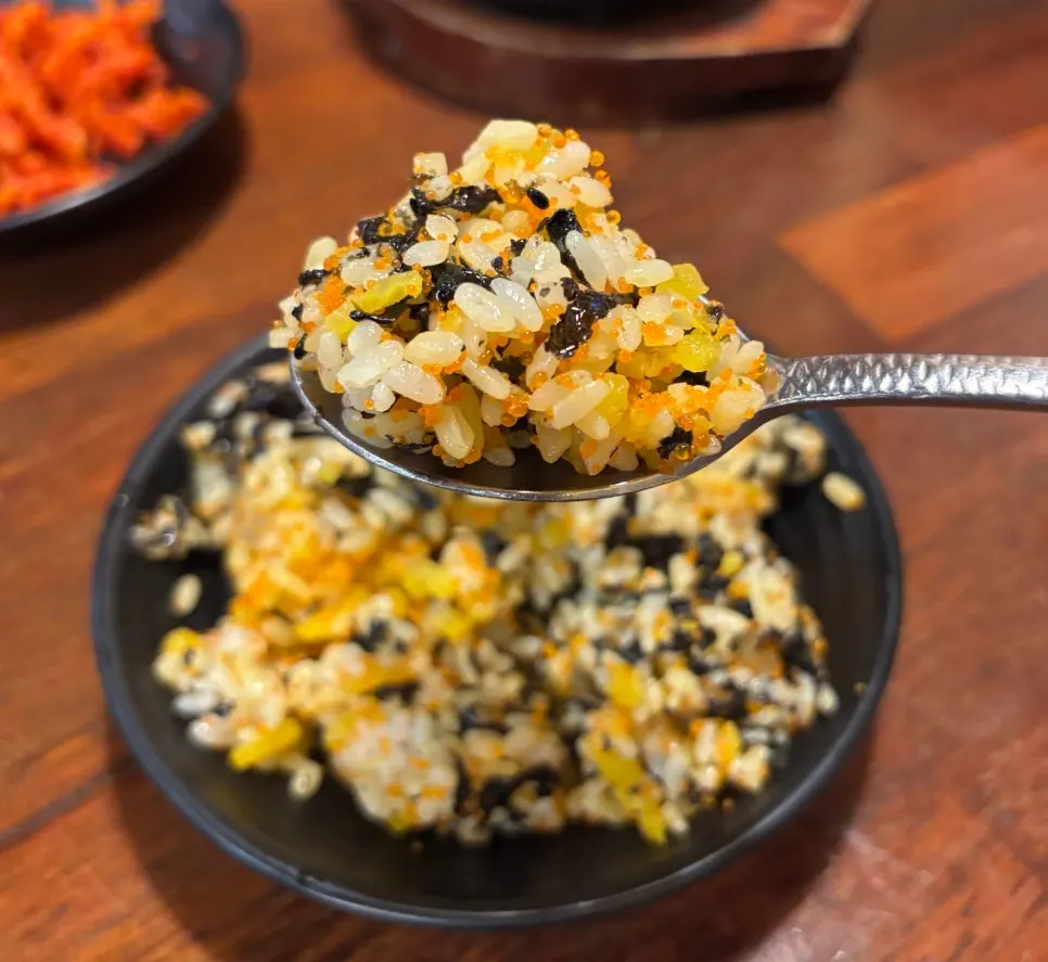 Close-up of fried rice topped with flying fish roe