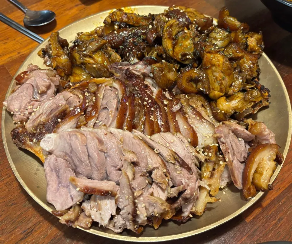 Full table spread with half-and-half jokbal and basics