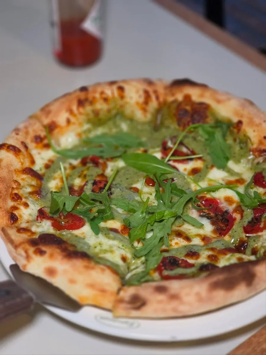 Wrapping enoki mushrooms in the pizza