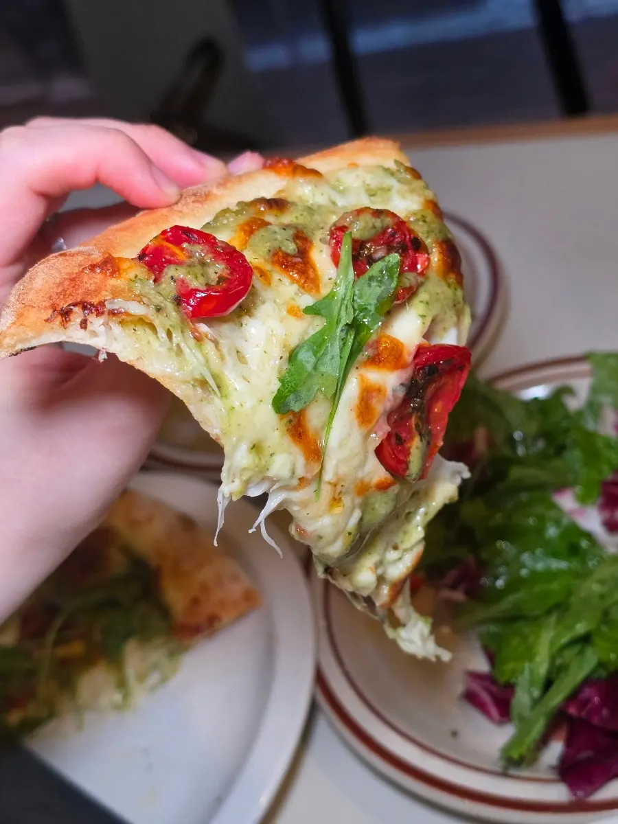 A whole basil margherita pizza