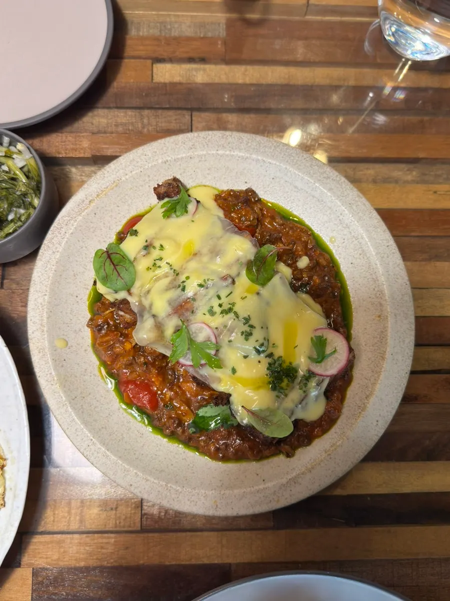 Plating of Greek-style moussaka lasagna