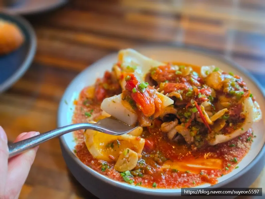 Cuttlefish dish with tomato sauce