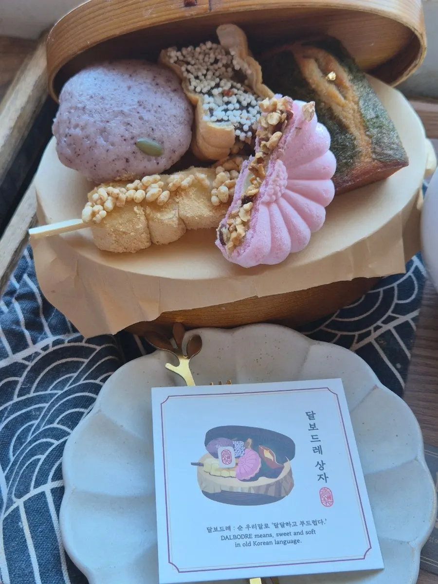 Close-up of the injeolmi skewer and monaka in the dessert set