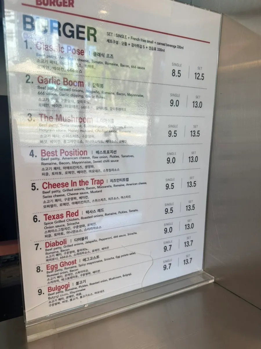 Burger menu board with ingredient descriptions at 666 Burger