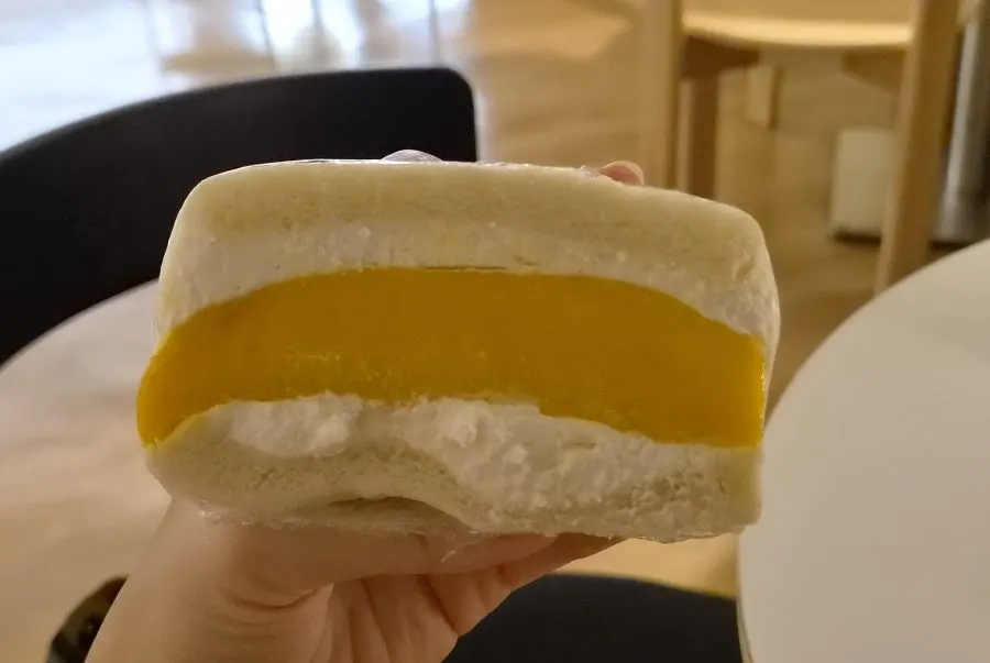 Cross-section of the sando with a big chunk of apple mango