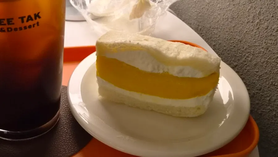 A bite taken out of the apple mango sando
