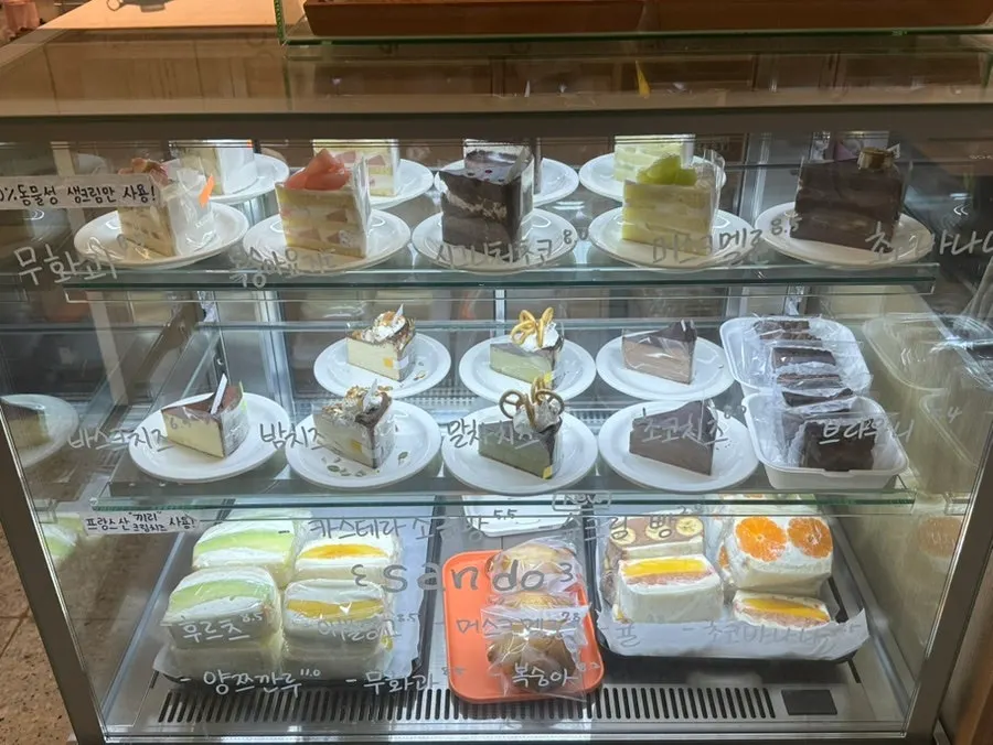Showcase filled with fresh cream cakes