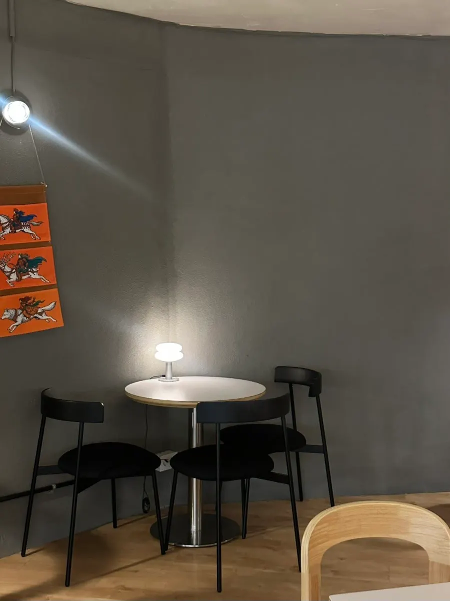 Softly lit seating in the back of the café
