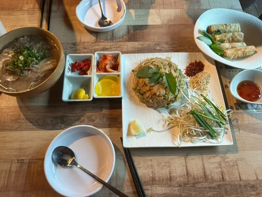 Pad thai, pho, and bun cha all laid out together