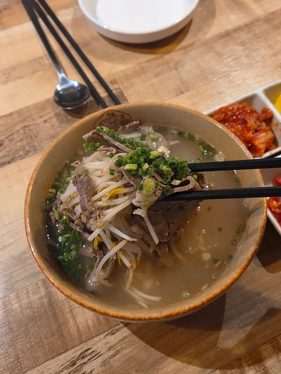 Noodles lifted from the beef brisket pho