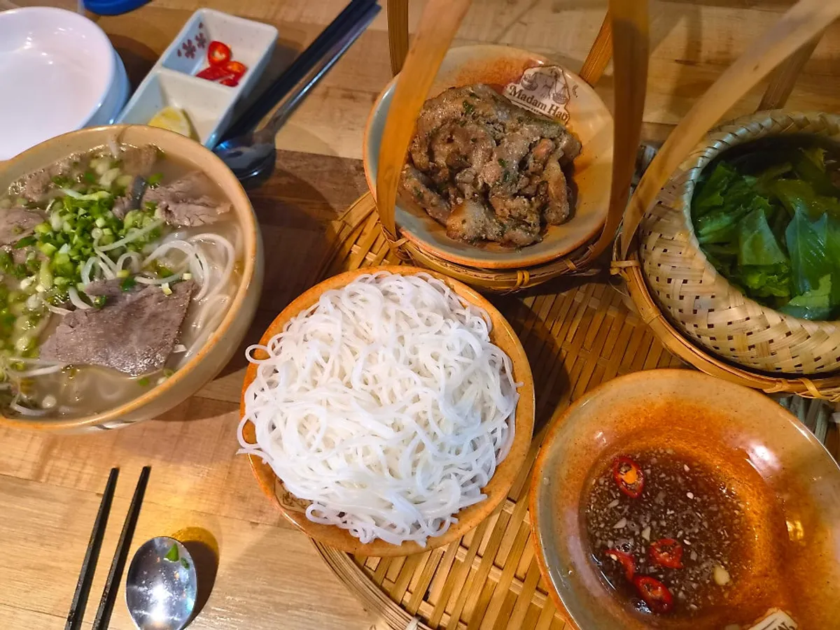 A spread of Madam Hao's beef brisket pho and bun cha