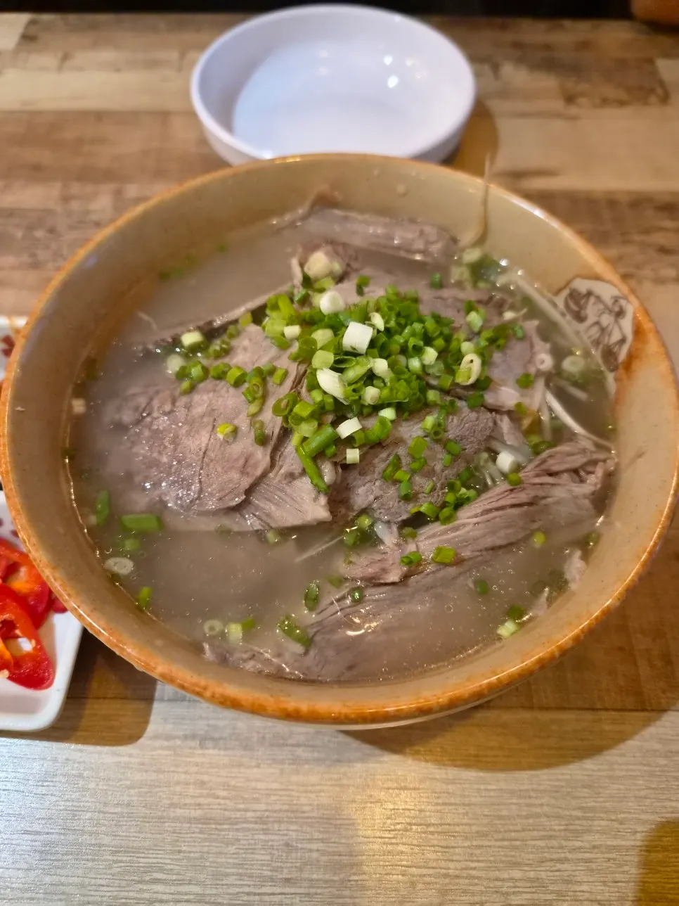 Madam Hao's beef brisket pho topped with brisket slices