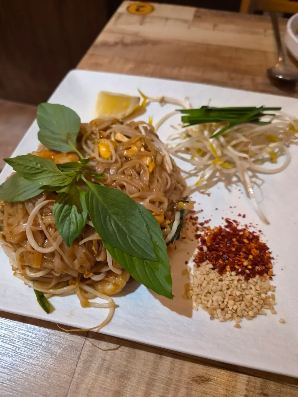 Madam Hao's pad thai coated evenly in sauce