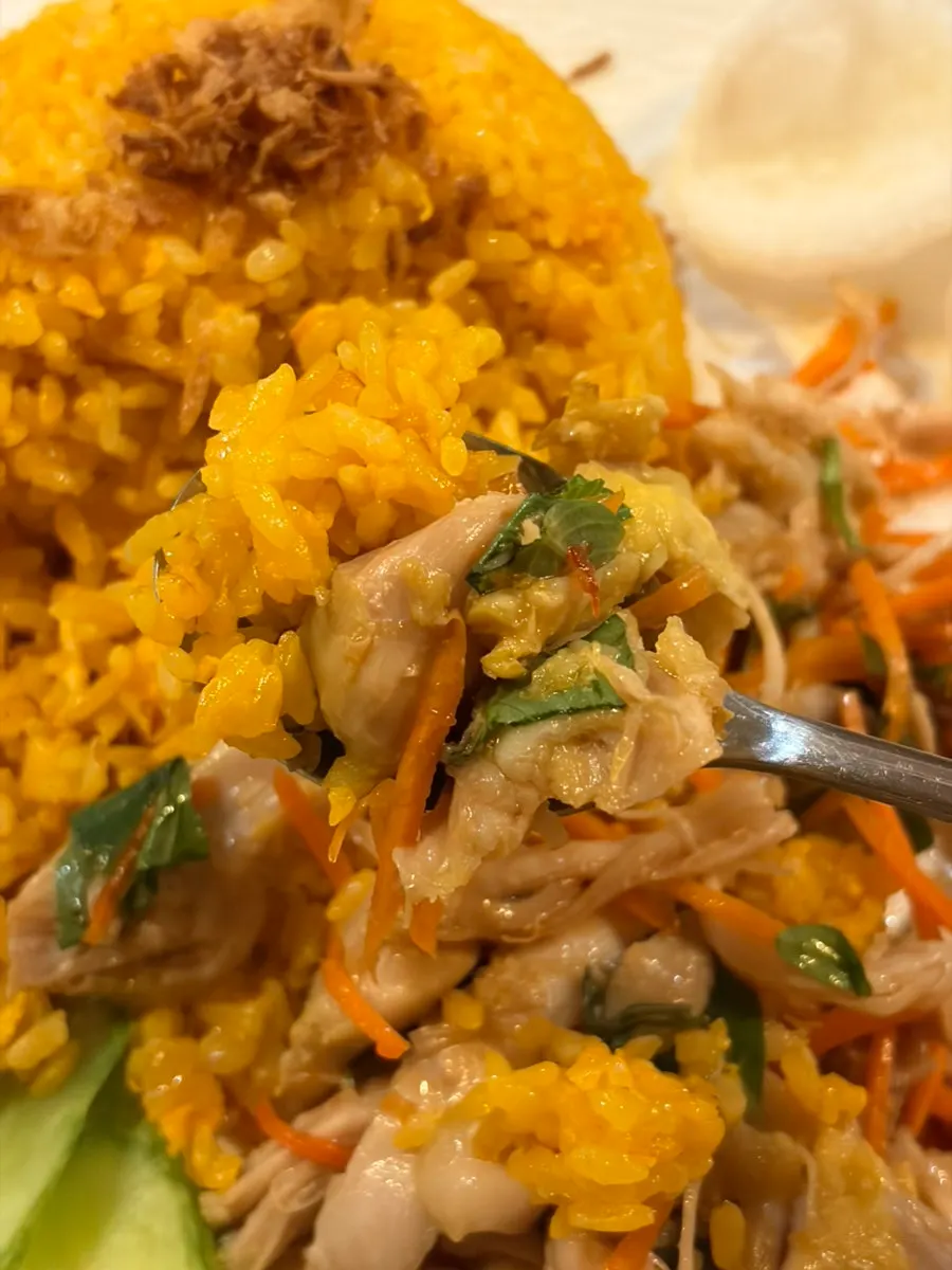 Nearly finished bowl of chicken rice bowl