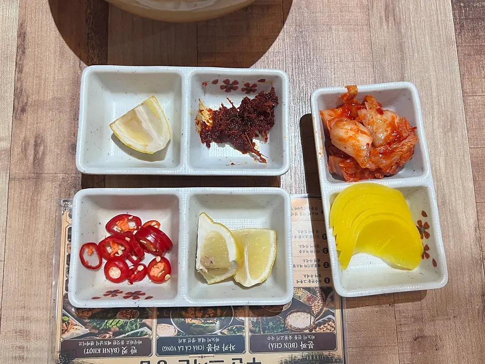 Toppings and side dishes served first at Madam Hao