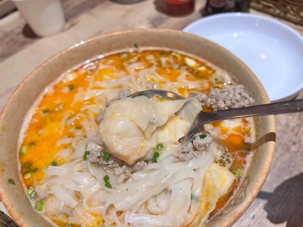 Tom yum pho with meatball and shrimp toppings