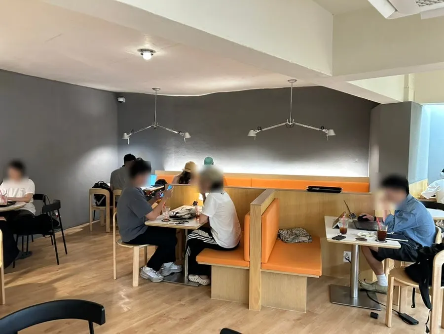 Two-to-four-person seating area at Jo Hui-tak Coffee