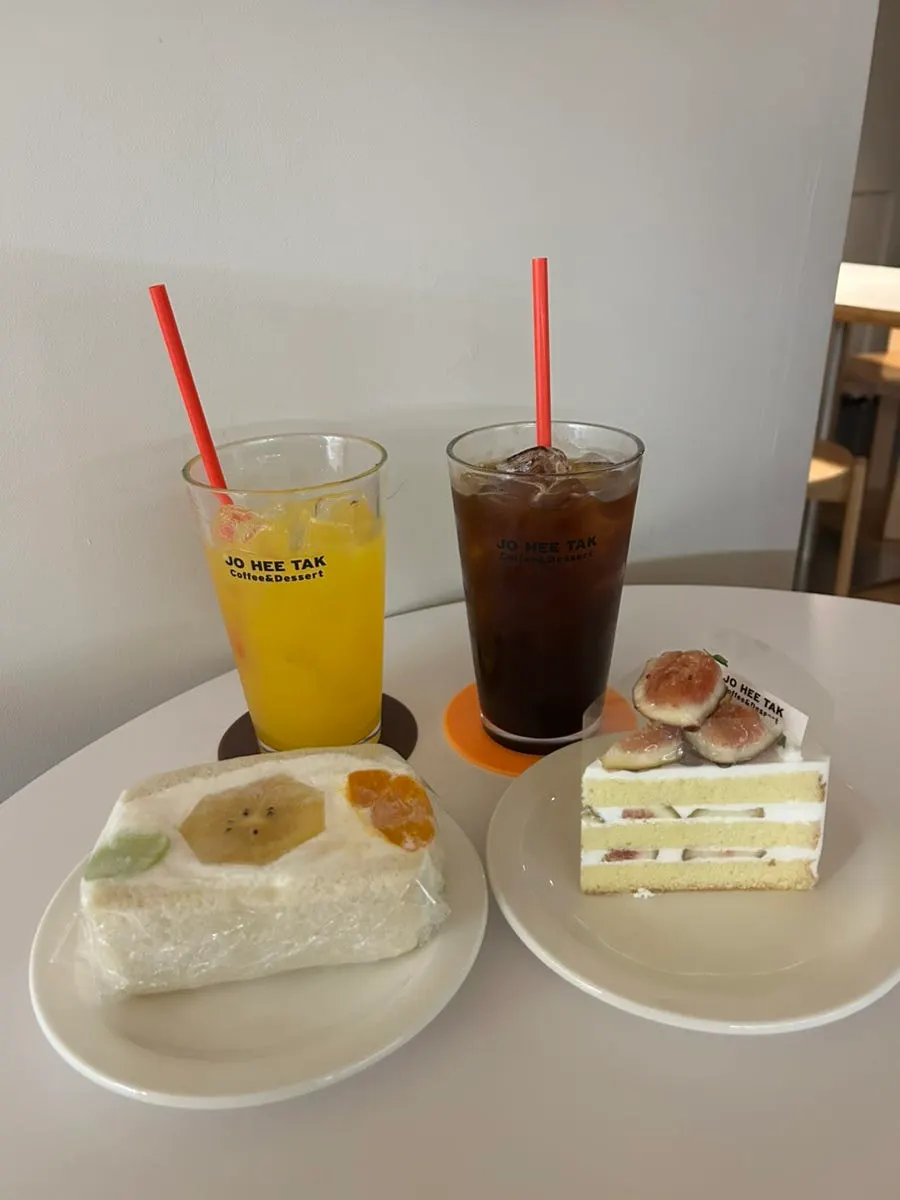 Fresh orange juice, decaf coffee, sando, and cake