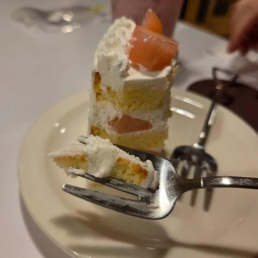 Peach yogurt cake and drink together on the table