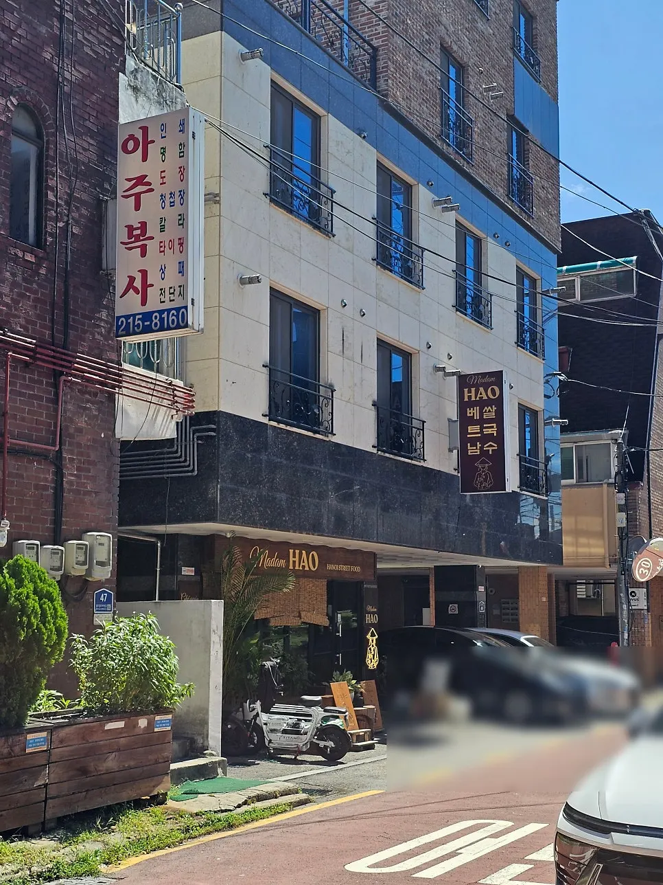 Madam Hao's flashy exterior seen from the alley