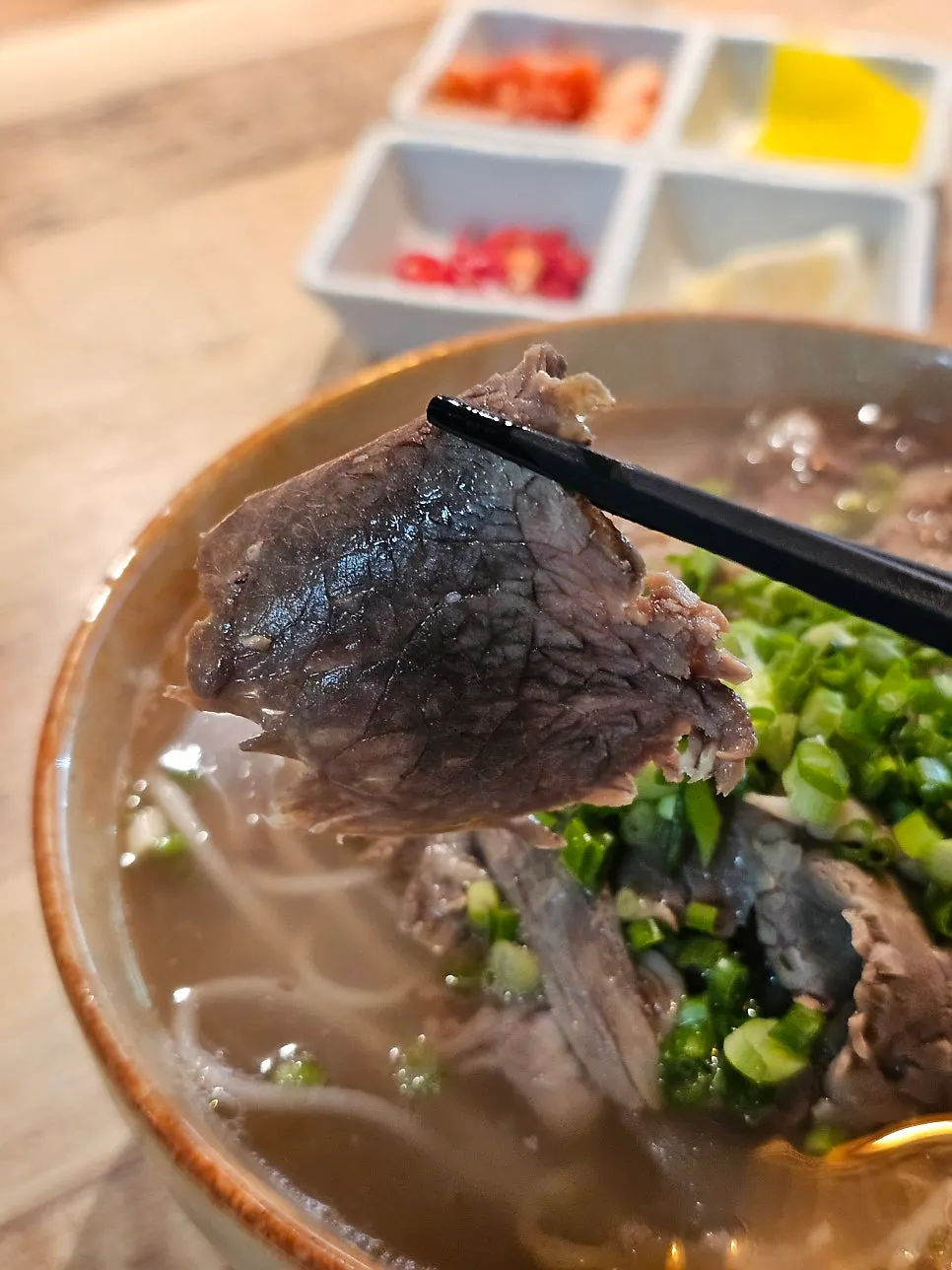 Tender beef brisket pho served with lemon