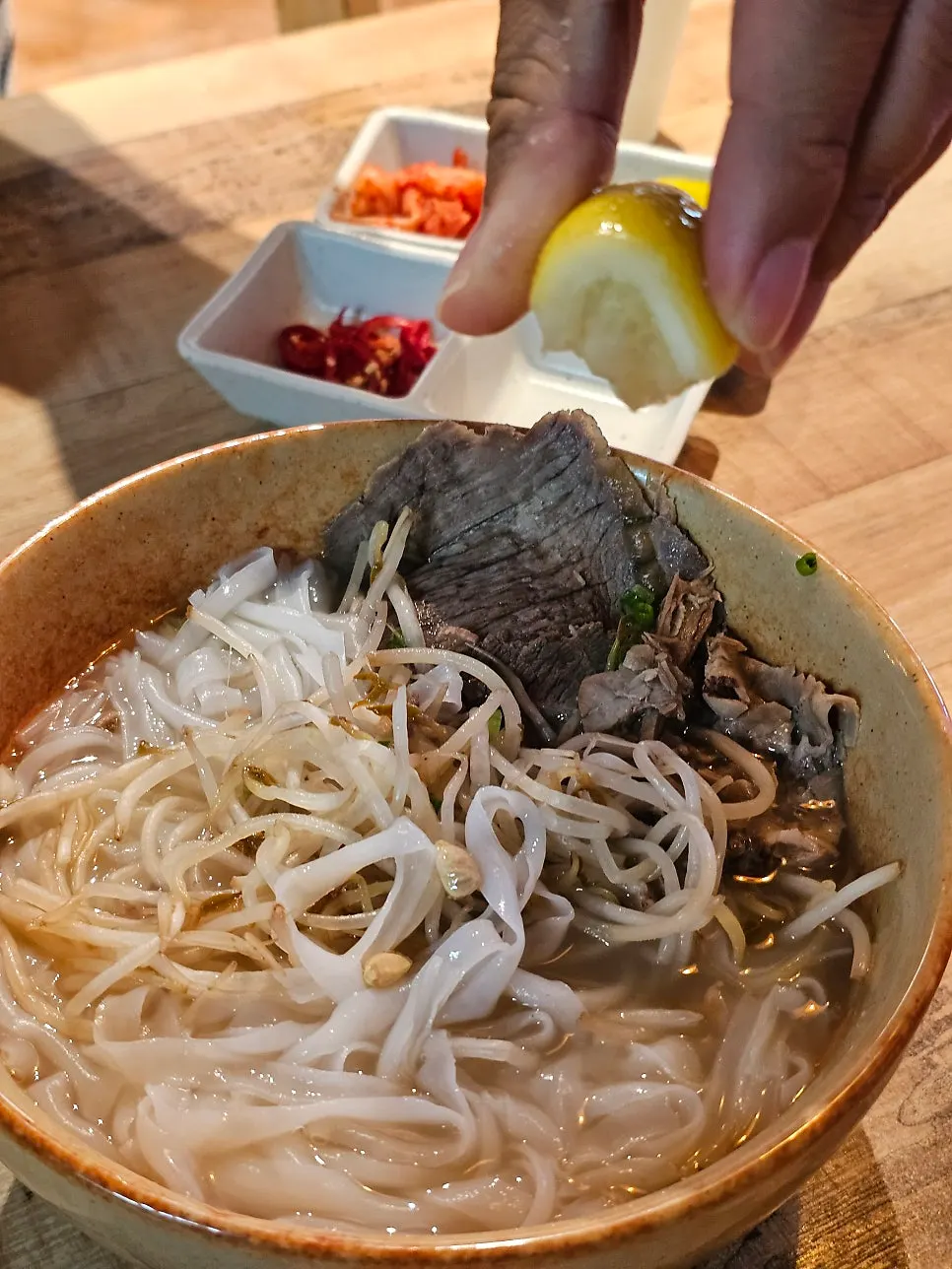 Beef brisket pho brightened with tangy lemon