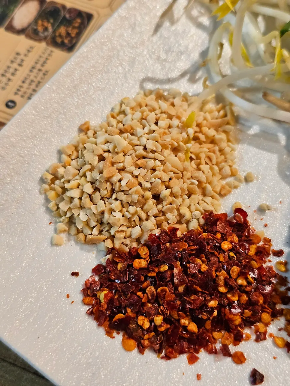 Pad thai with peanuts and spicy chili served separately