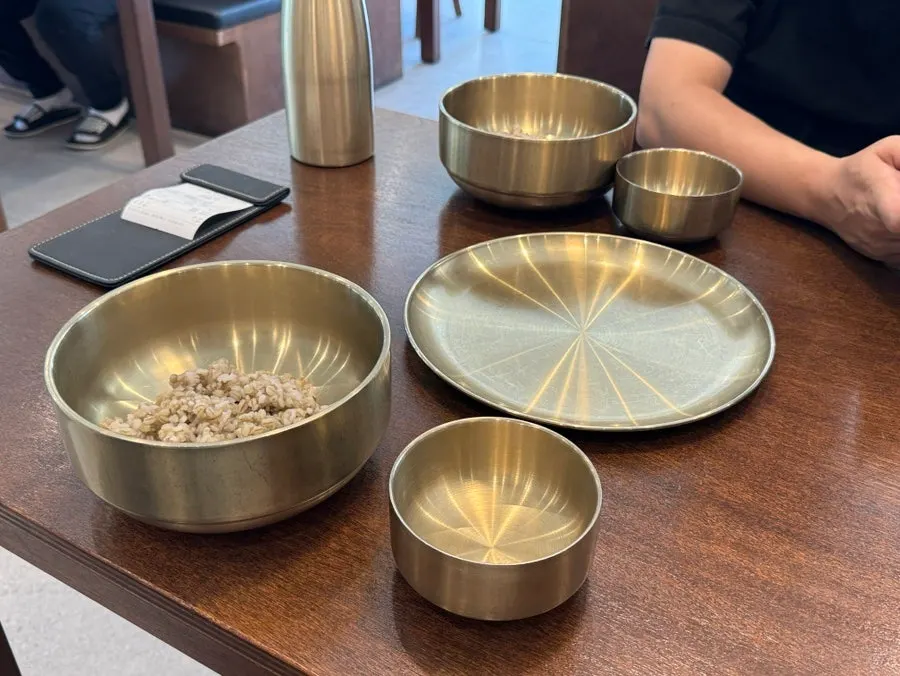 Basic table setting with barley rice and empty bowls