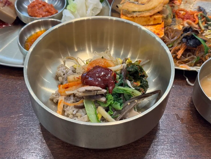 Namul side dishes piled on top of barley rice