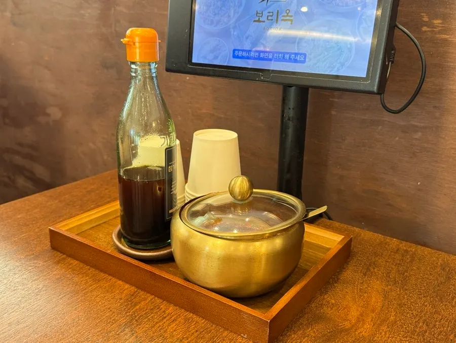 Gochujang sauce and sesame oil on the table