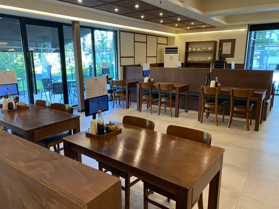 Restaurant seating with four-person and larger group tables