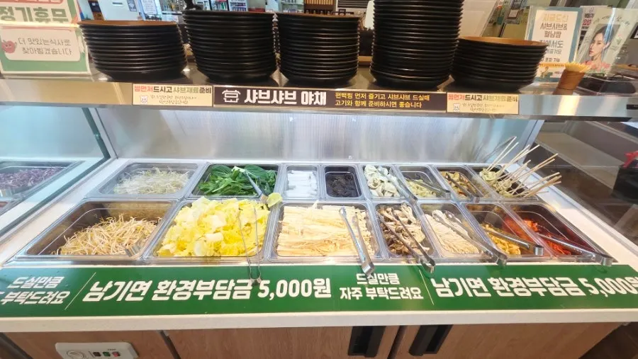 Plate of vegetables and side dishes from the salad bar