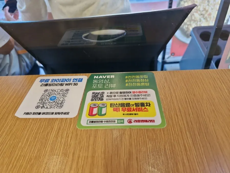 Self-service station with tableware and sauces