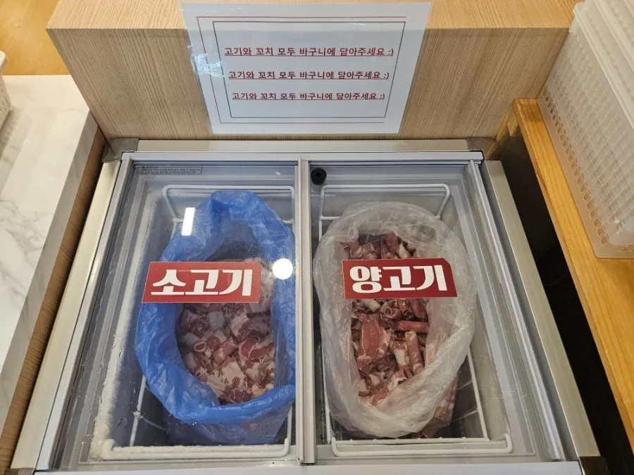 Display case of vegetables and noodles