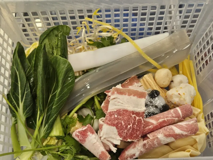 Basket filled with a variety of mala xiang guo ingredients
