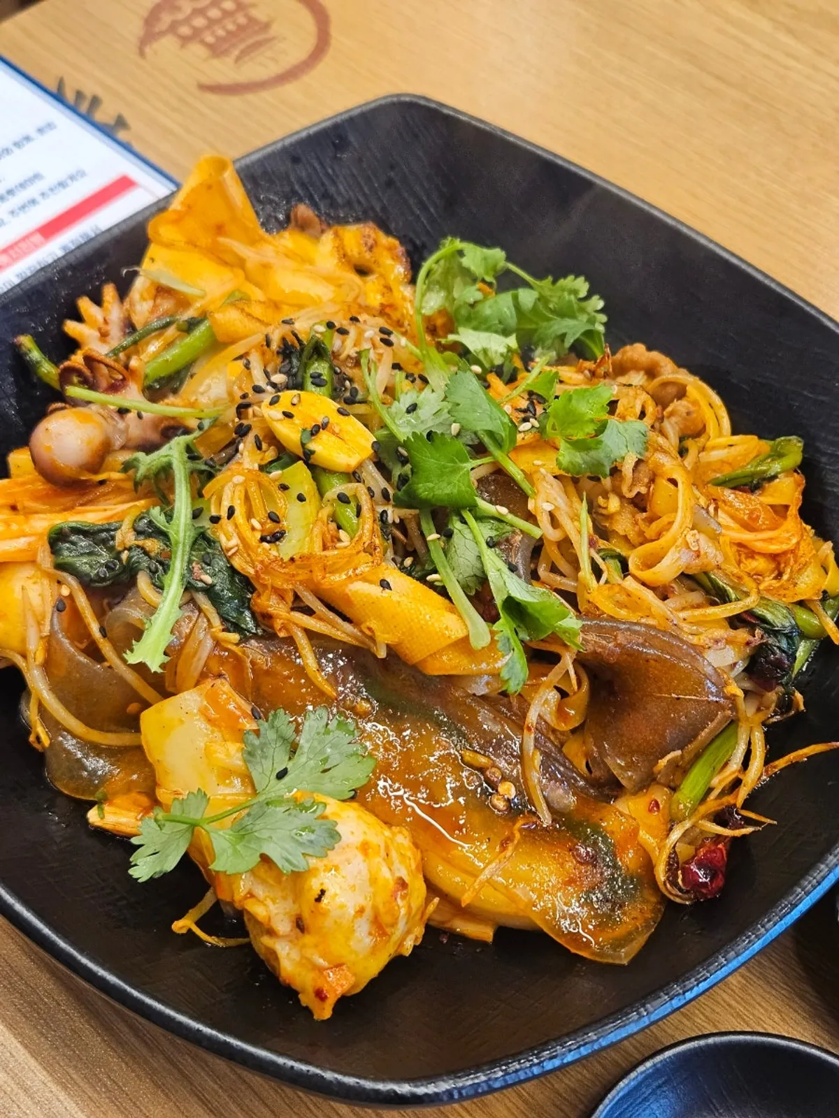 Close-up of mala xiang guo with sauce coating the ingredients