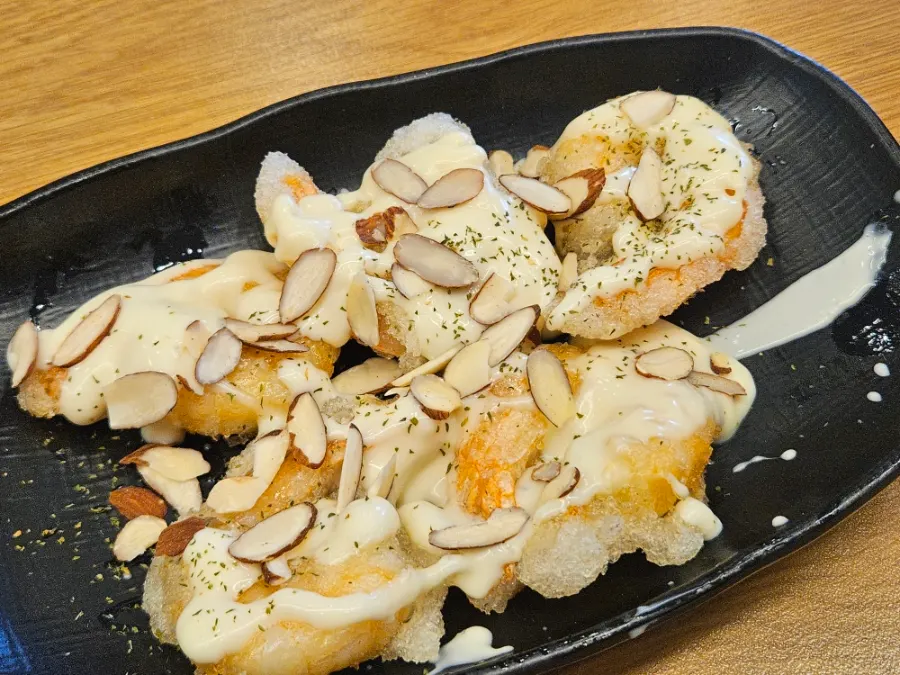 A single-serving plate of lemon cream shrimp