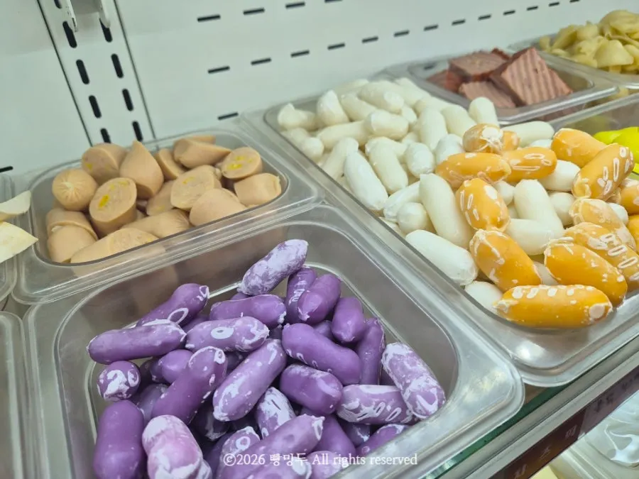 Display of sausages and rice cake varieties