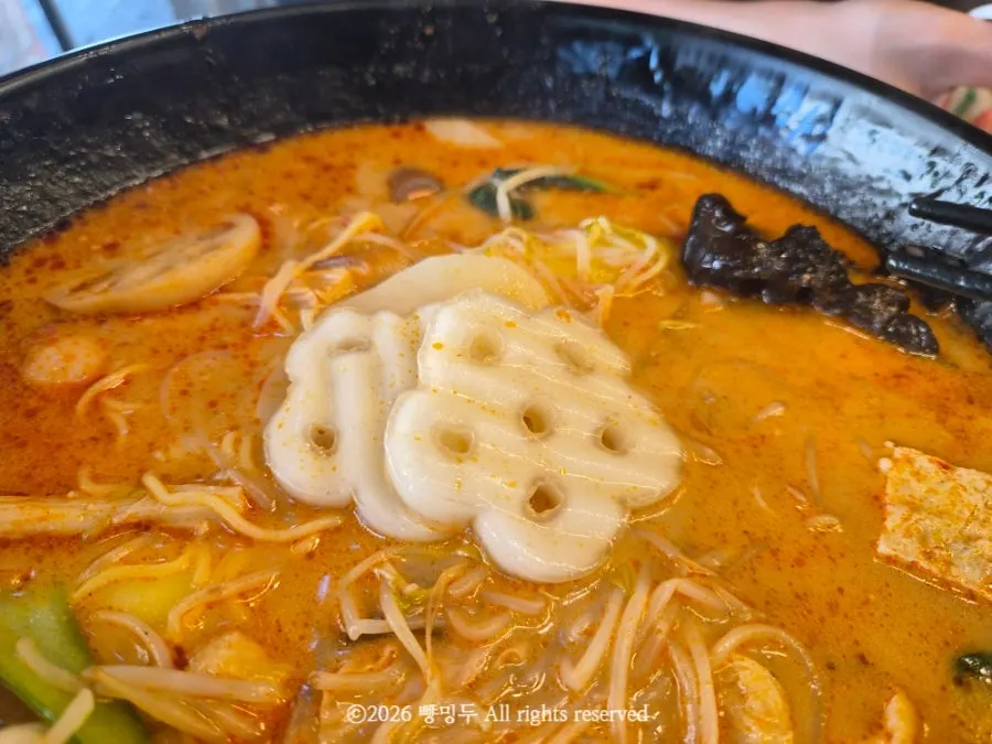Fenzi and other ingredients lifted up with chopsticks