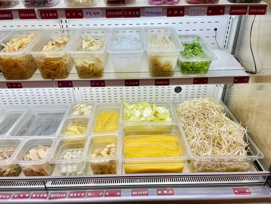 Tofu, vegetables, meat, and noodle ingredients