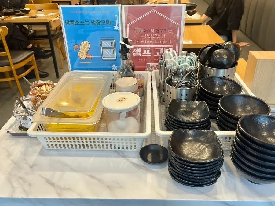 Self-service station with peanut sauce and pickled radish