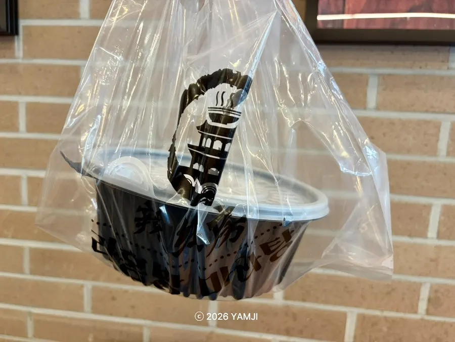 Leftover mala xiang guo packed up to take home